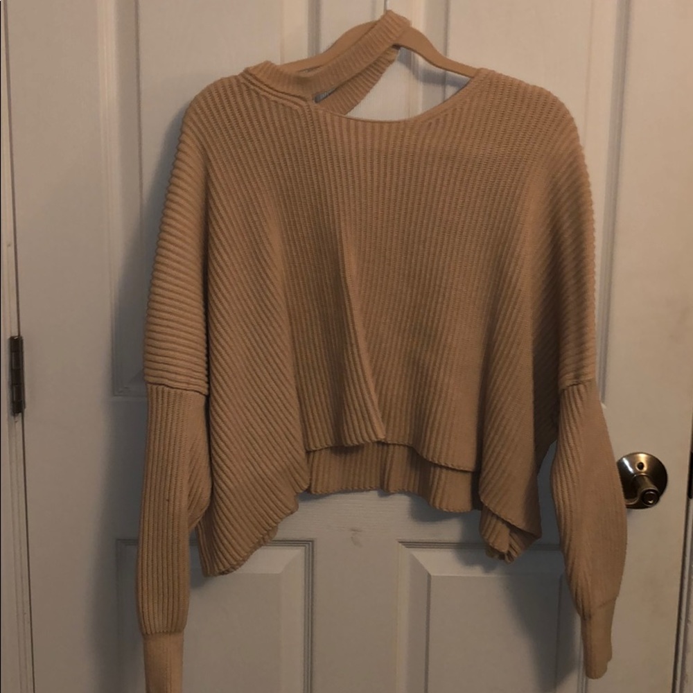 light pink/tan knit sweater with asymmetrical neck